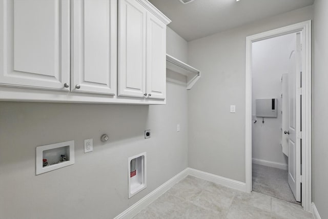 laundry area with baseboards, hookup for a washing machine, hookup for a gas dryer, cabinet space, and hookup for an electric dryer