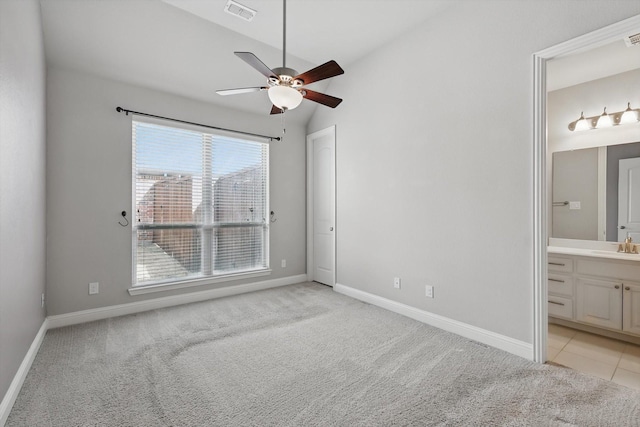 unfurnished bedroom with visible vents, light colored carpet, and baseboards