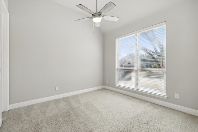 unfurnished room with baseboards, ceiling fan, and carpet flooring