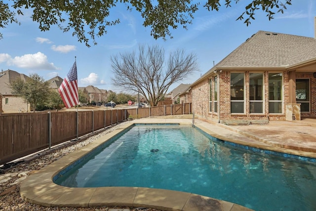 view of pool with a patio, a fenced backyard, and a fenced in pool