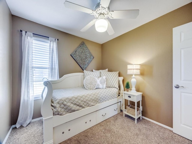 bedroom with baseboards, light colored carpet, and ceiling fan