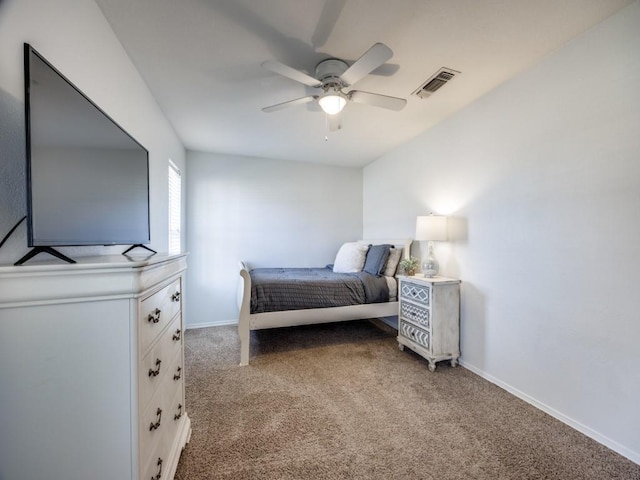 carpeted bedroom featuring baseboards, visible vents, and ceiling fan