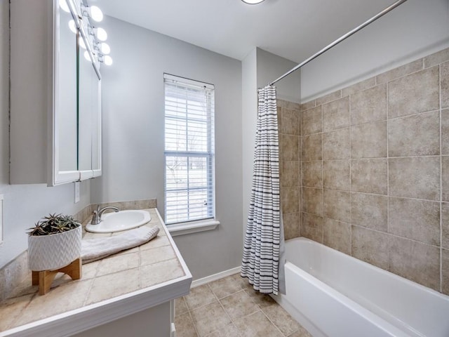 full bathroom with baseboards, shower / bath combo, vanity, and tile patterned flooring