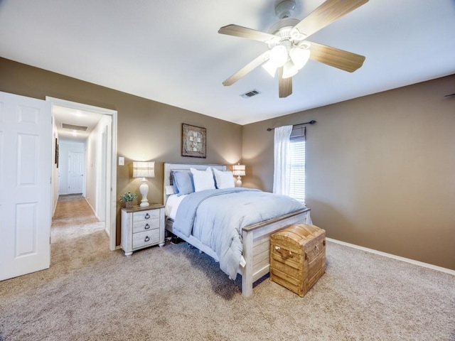 bedroom with visible vents, baseboards, and carpet