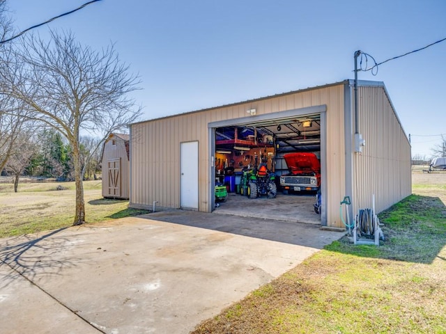 view of outbuilding featuring driveway and an outdoor structure