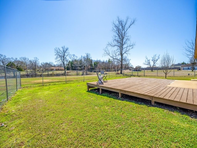 view of yard with a deck and fence