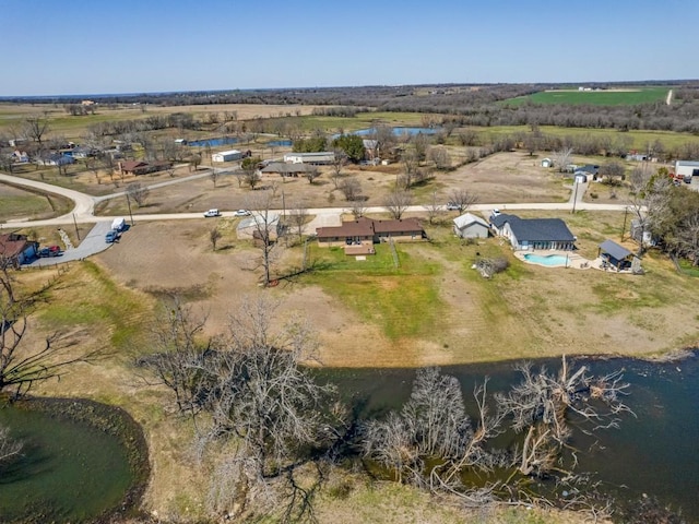 aerial view with a water view and a rural view