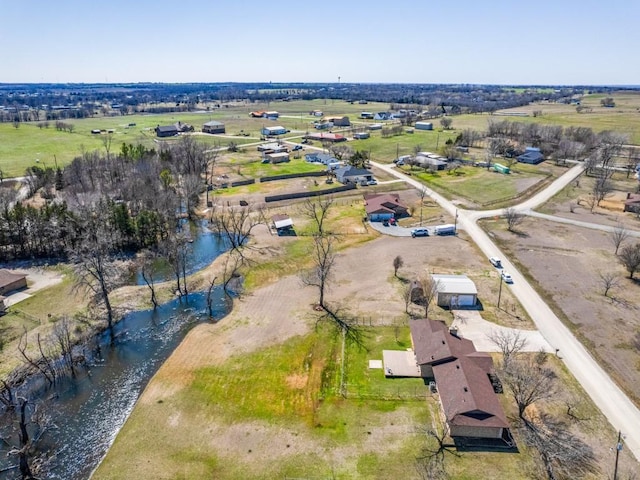 birds eye view of property with a rural view