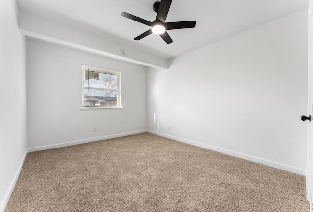 empty room with baseboards, carpet, and a ceiling fan