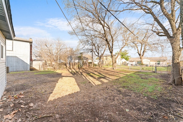 view of yard with fence and a residential view