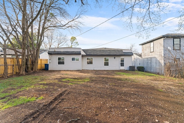 back of property featuring cooling unit and fence private yard