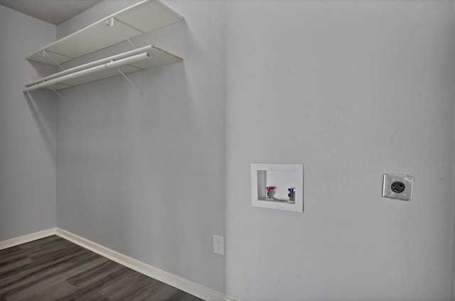 clothes washing area featuring baseboards, dark wood finished floors, laundry area, electric dryer hookup, and washer hookup