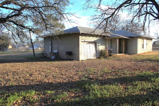 view of property exterior with an attached garage