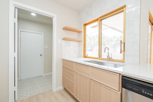 kitchen featuring a sink, light brown cabinets, dishwasher, light countertops, and open shelves