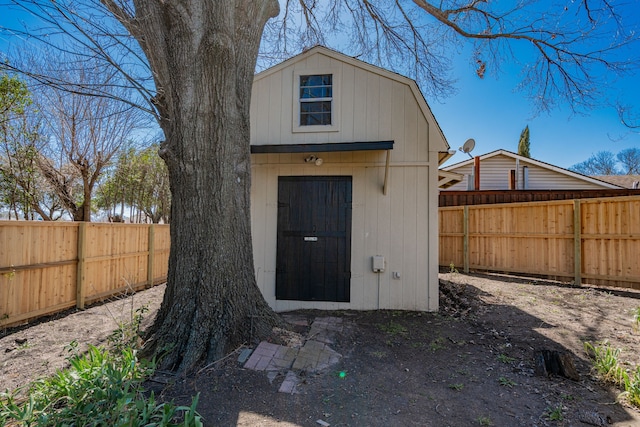 view of shed featuring a fenced backyard