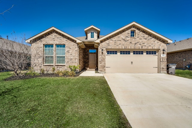 view of front of home featuring brick siding, an attached garage, concrete driveway, and a front yard