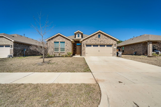 view of front of property with brick siding, concrete driveway, and an attached garage