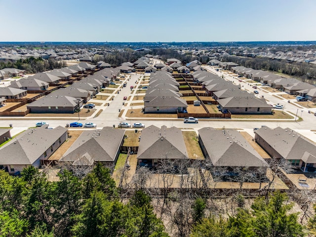 birds eye view of property with a residential view