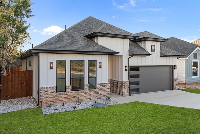 view of front facade with driveway, brick siding, an attached garage, and a shingled roof