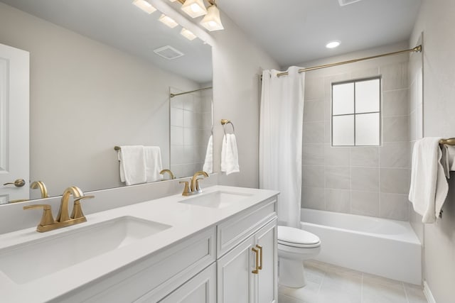 bathroom featuring a sink, toilet, shower / tub combo, and tile patterned flooring