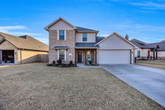 traditional-style home with fence, driveway, a shingled roof, a garage, and brick siding