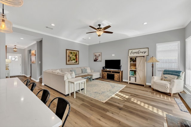 living area with light wood-style flooring, recessed lighting, baseboards, and visible vents