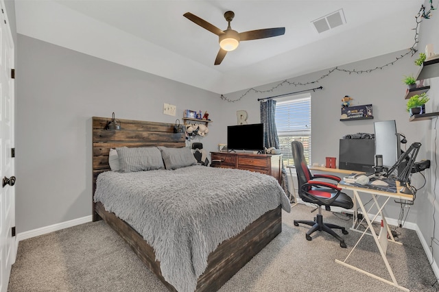 carpeted bedroom featuring a ceiling fan, baseboards, and visible vents