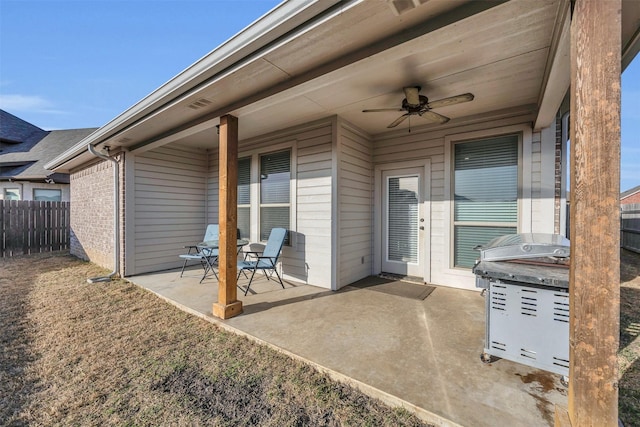 view of patio / terrace featuring a ceiling fan and fence