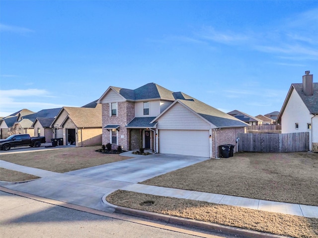 traditional-style house featuring fence, an attached garage, a residential view, concrete driveway, and brick siding