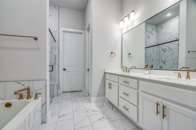 bathroom with a marble finish shower, marble finish floor, double vanity, and a sink