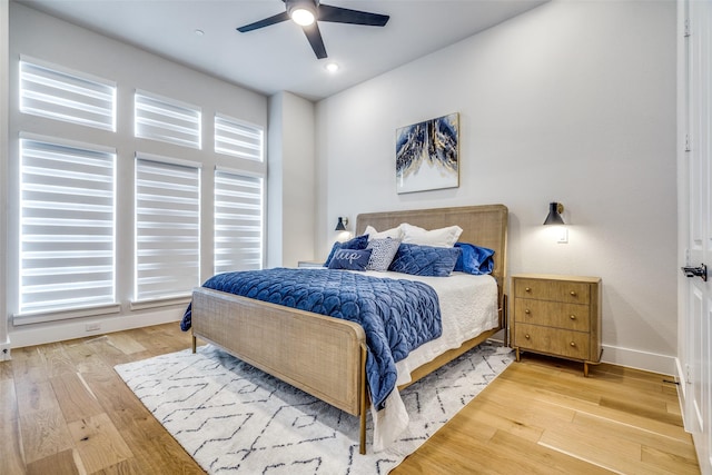 bedroom with recessed lighting, baseboards, light wood-style floors, and ceiling fan