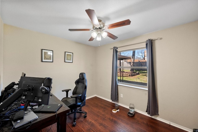 office space featuring a ceiling fan, baseboards, and wood-type flooring