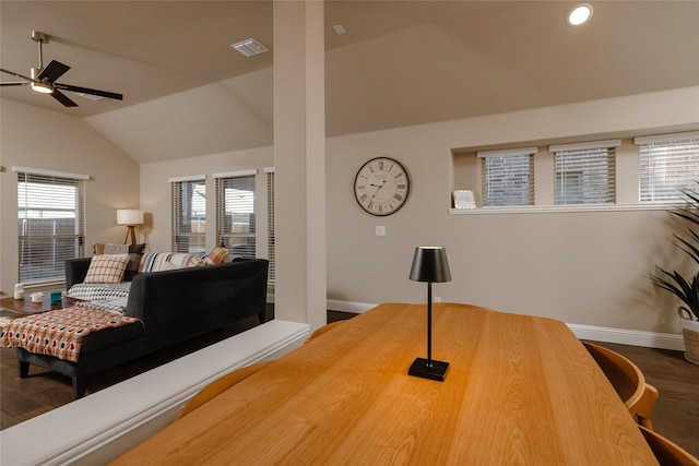 dining space with visible vents, a healthy amount of sunlight, baseboards, and lofted ceiling