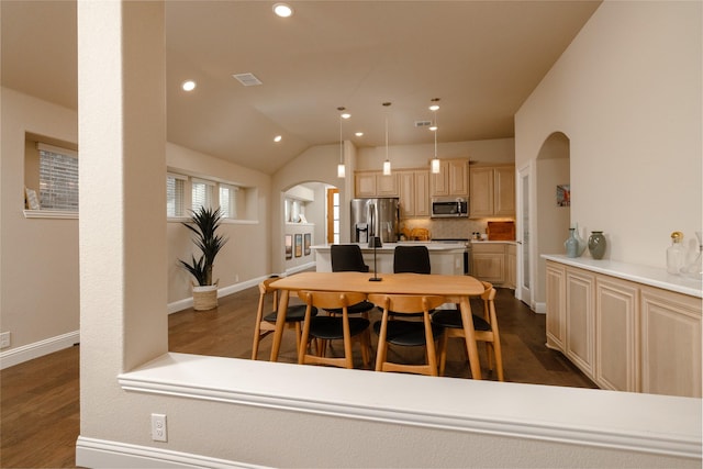 dining area featuring recessed lighting, visible vents, arched walkways, and dark wood-style flooring