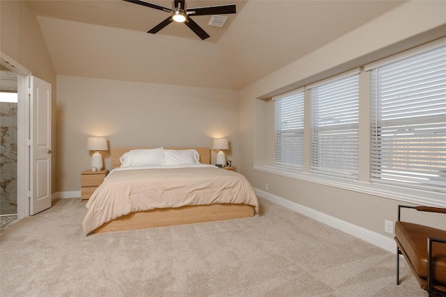 carpeted bedroom featuring visible vents, multiple windows, baseboards, and ceiling fan