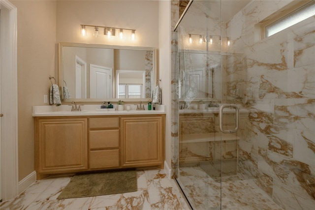 bathroom with vanity, marble finish floor, and a marble finish shower