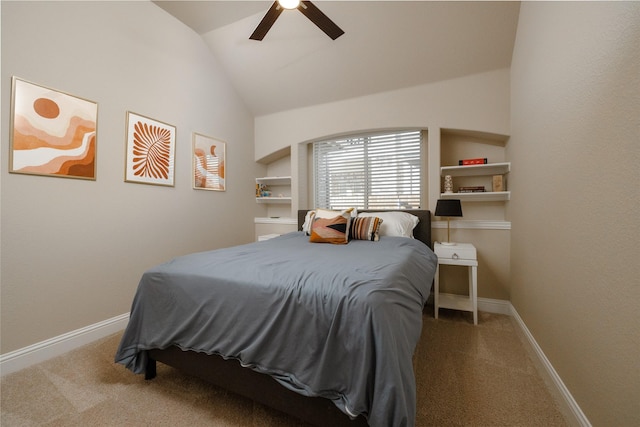 carpeted bedroom featuring baseboards, lofted ceiling, and a ceiling fan