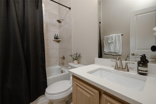 bathroom with vanity, toilet, and shower / bath combo with shower curtain