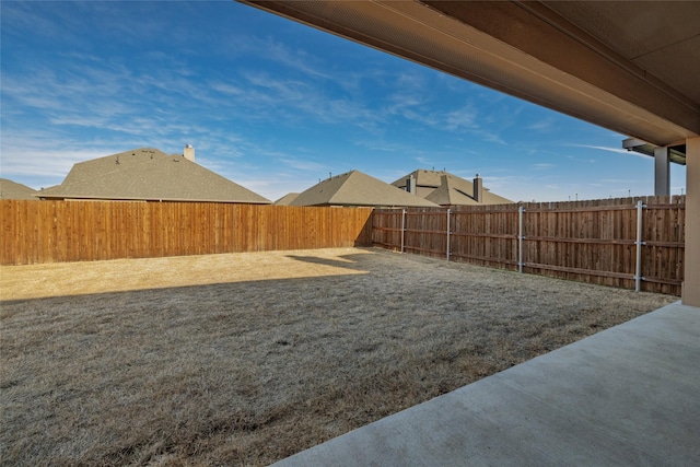 view of yard with a fenced backyard