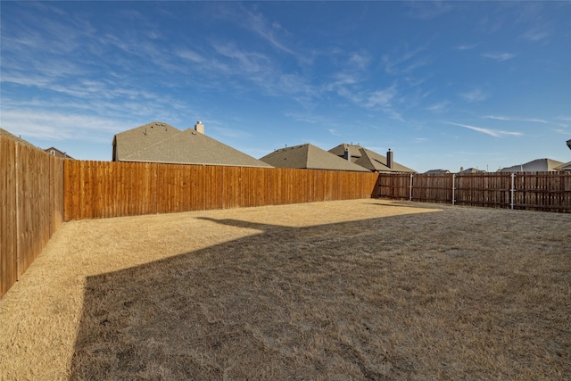 view of yard featuring a fenced backyard