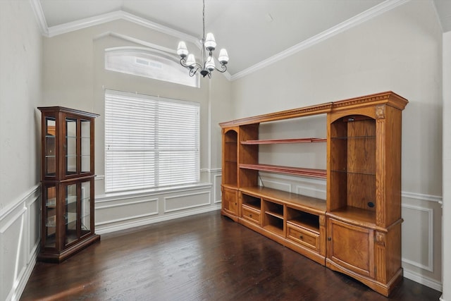 dining area with a notable chandelier, ornamental molding, dark wood-style floors, a decorative wall, and lofted ceiling