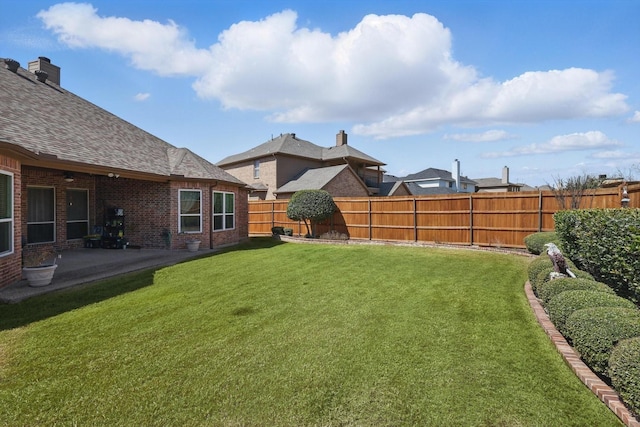 view of yard with a fenced backyard and a patio area