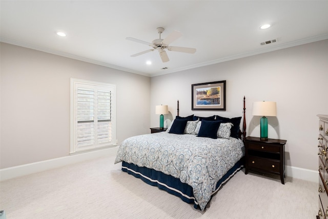 bedroom featuring visible vents, light colored carpet, and crown molding