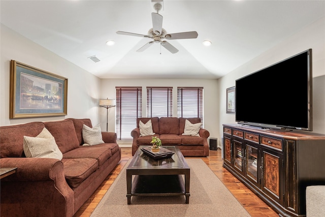 living area featuring recessed lighting, light wood-type flooring, lofted ceiling, and ceiling fan