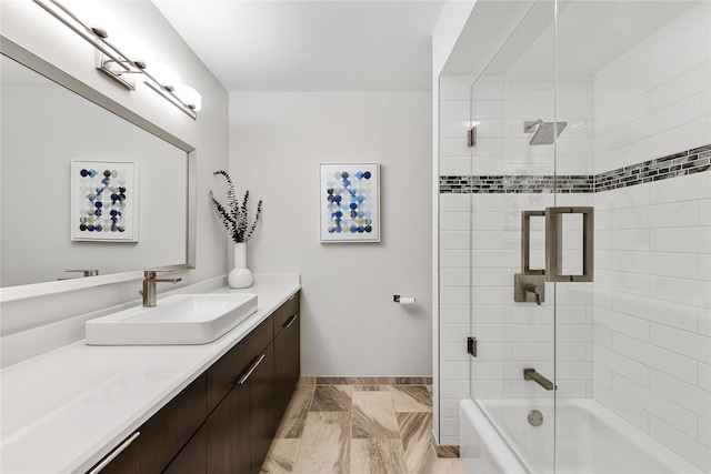 bathroom featuring marble finish floor, vanity, baseboards, and bath / shower combo with glass door