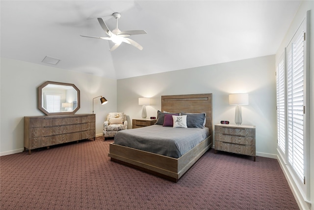 carpeted bedroom featuring baseboards, lofted ceiling, visible vents, and ceiling fan