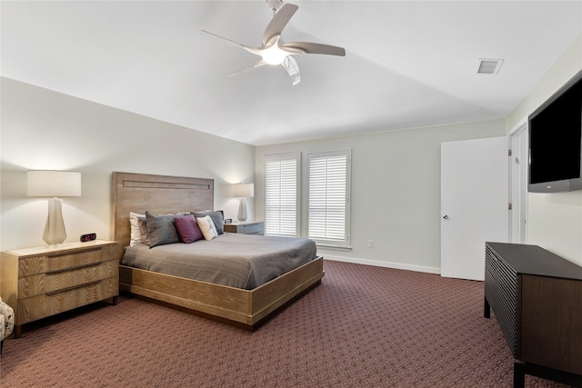 bedroom with visible vents, baseboards, a ceiling fan, and dark carpet