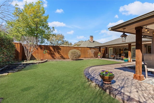 view of yard with a patio area and a fenced backyard