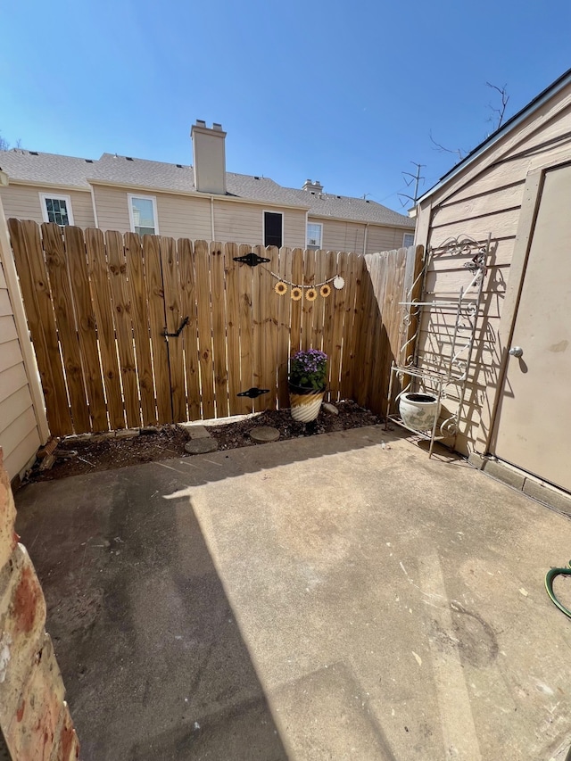 view of patio / terrace featuring fence