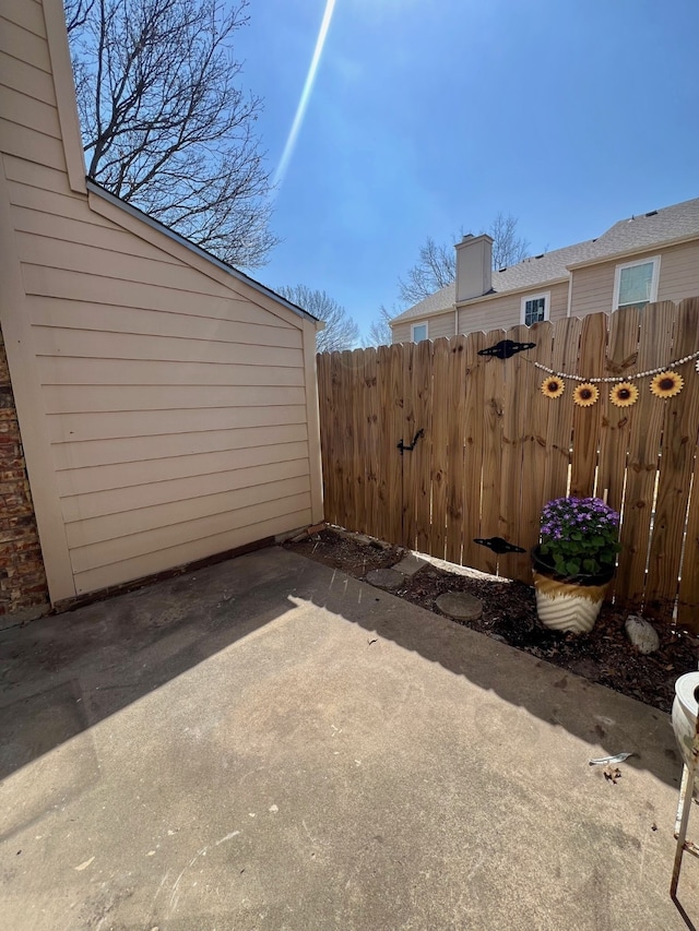 view of patio / terrace featuring fence